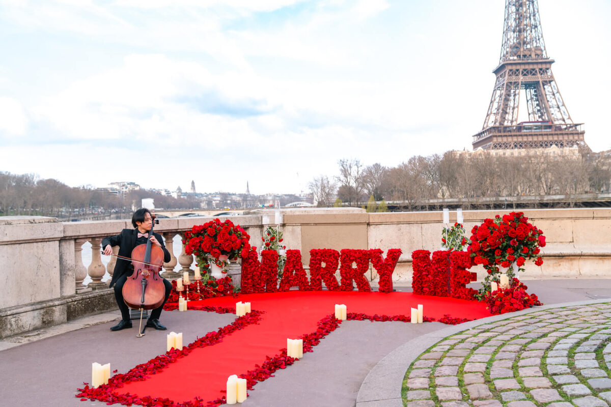 stunning Marry me Letters setup at Bir-hakeim bridge Eiffel Tower - rose petals and master musician